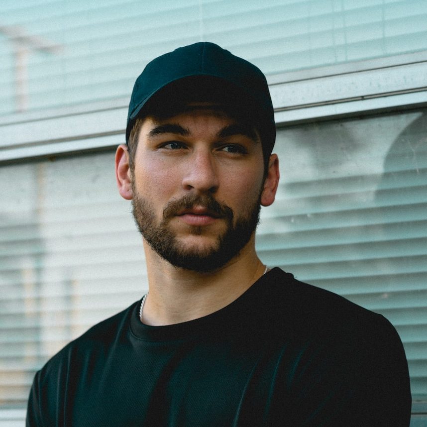 man standing in front of window